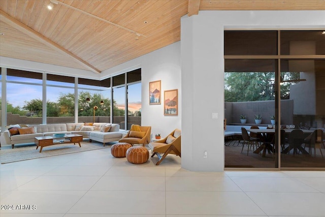 tiled living room featuring a towering ceiling and wood ceiling