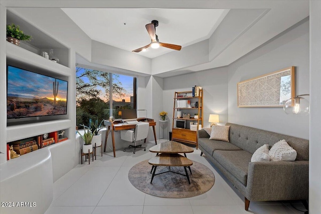 living room with built in shelves, a healthy amount of sunlight, light tile patterned floors, and ceiling fan