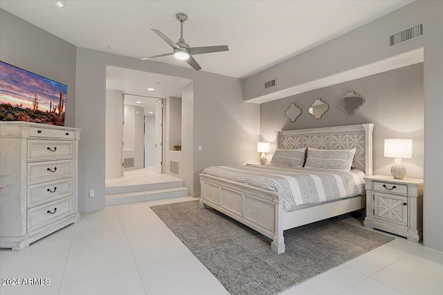 tiled bedroom with ceiling fan