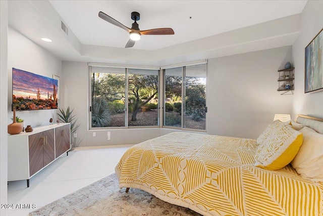 tiled bedroom with ceiling fan