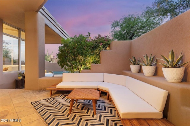 patio terrace at dusk with an outdoor hangout area