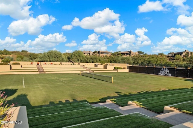 view of home's community with tennis court