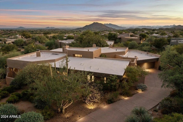 aerial view at dusk with a mountain view