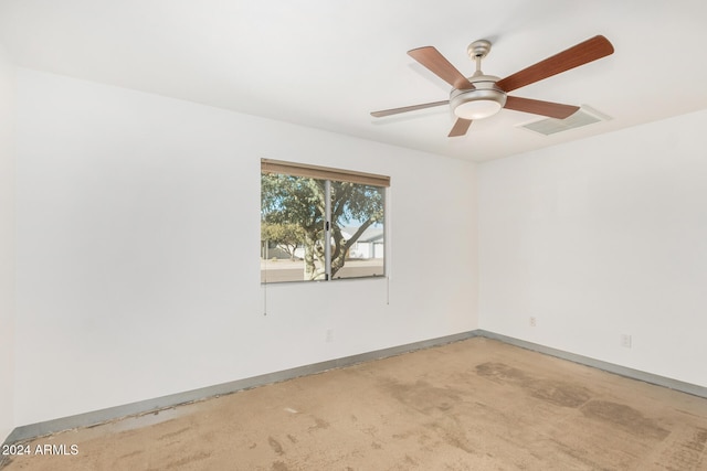 unfurnished room featuring light carpet and ceiling fan