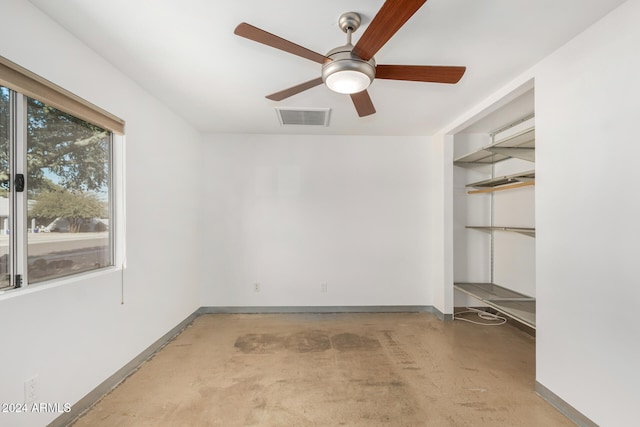 unfurnished room with ceiling fan