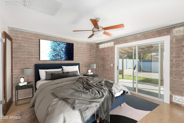 3033 E Sierra St, Phoenix, AZ 85028 - bedroom with brick wall, access to outside, concrete flooring, and ceiling fan
