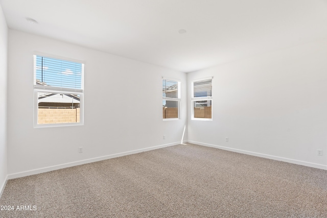 40040 W Agave Rd, Maricopa, AZ 85138 - empty room featuring carpet flooring and baseboards