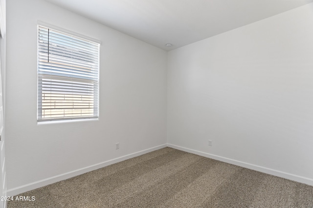 40040 W Agave Rd, Maricopa, AZ 85138 - spare room featuring carpet floors and baseboards