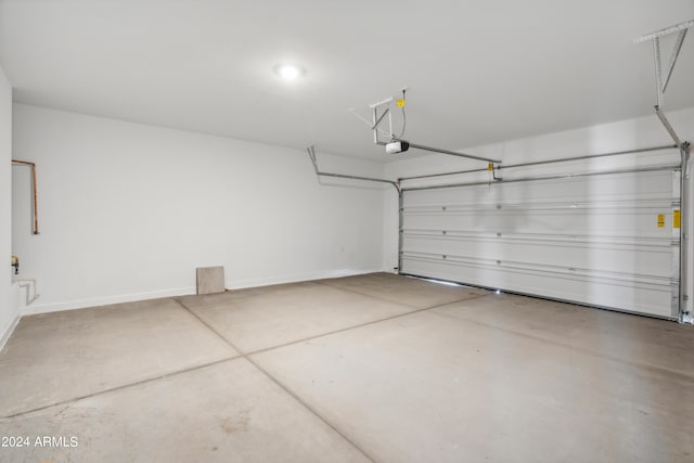 40040 W Agave Rd, Maricopa, AZ 85138 - garage with baseboards and a garage door opener