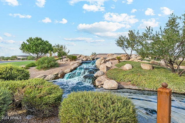 40040 W Agave Rd, Maricopa, AZ 85138 - view of home's community featuring a garden pond