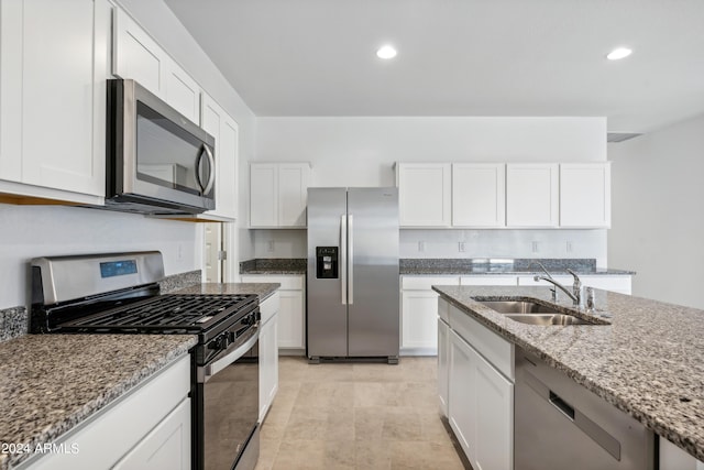 40040 W Agave Rd, Maricopa, AZ 85138 - kitchen featuring stainless steel appliances, light stone countertops, white cabinets, and recessed lighting