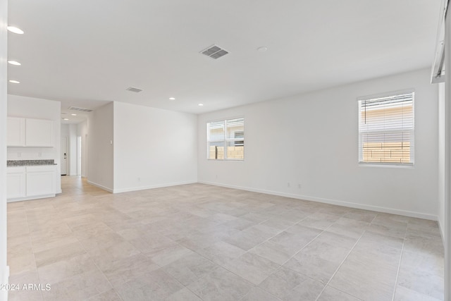 40040 W Agave Rd, Maricopa, AZ 85138 - unfurnished room featuring recessed lighting and light tile patterned flooring