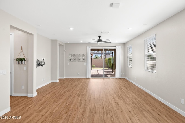 unfurnished living room with baseboards, a ceiling fan, light wood-style flooring, and recessed lighting