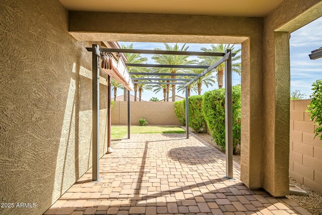 view of patio / terrace with a fenced backyard and a pergola