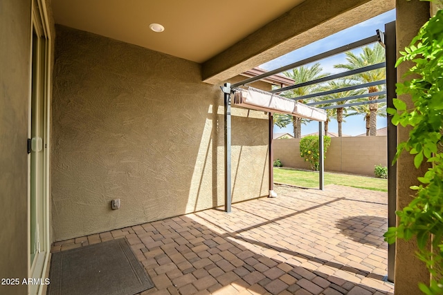 view of patio with fence and a pergola