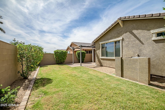 view of yard featuring a fenced backyard and a patio area