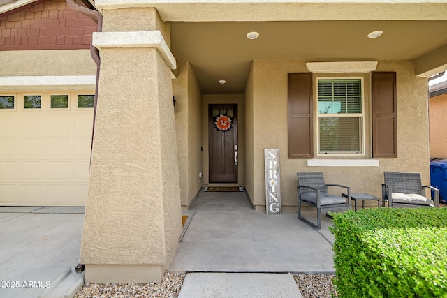 view of exterior entry with stucco siding
