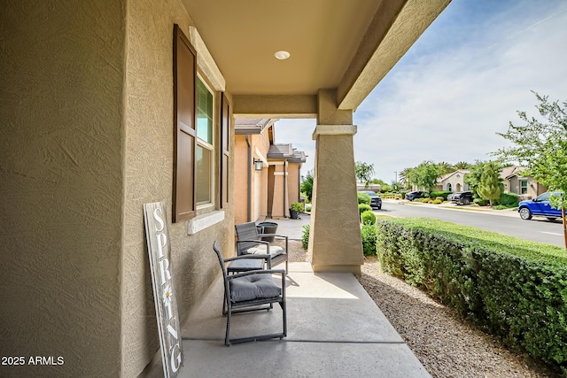 view of patio featuring a residential view and covered porch