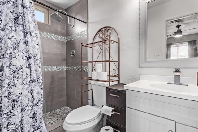 7357 W Cheryl Dr, Peoria, AZ 85345 - bathroom featuring toilet, vanity, a tile shower, and visible vents