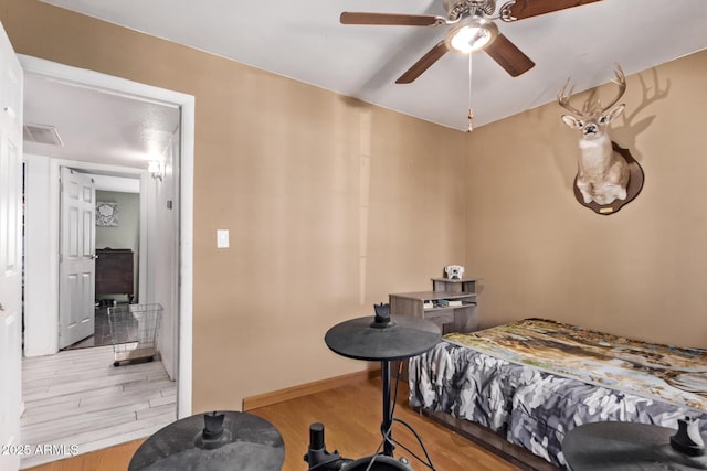 7357 W Cheryl Dr, Peoria, AZ 85345 - bedroom with light wood finished floors, baseboards, a ceiling fan, and visible vents