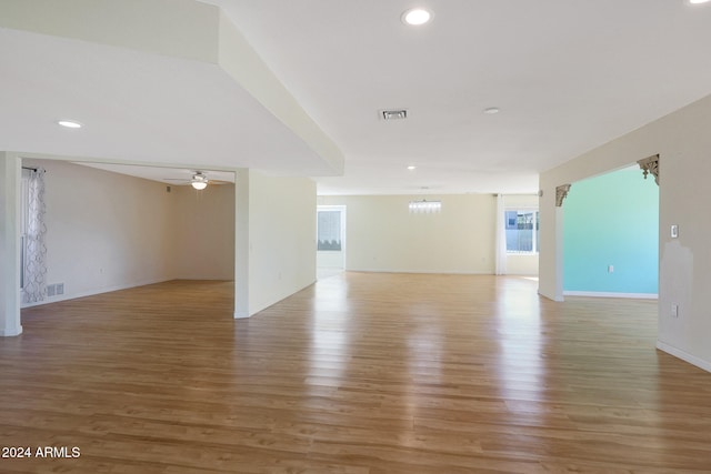 spare room featuring light wood-style floors, ceiling fan, visible vents, and recessed lighting