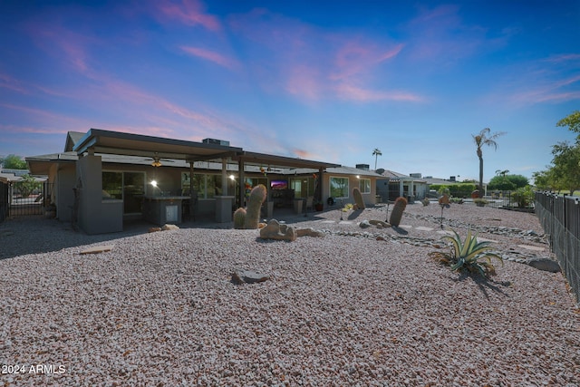 back of house featuring ceiling fan, a patio area, and fence