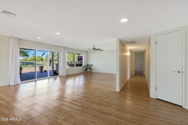 unfurnished room featuring light wood-type flooring, visible vents, a ceiling fan, and recessed lighting