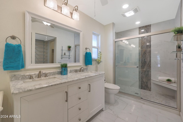 bathroom featuring marble finish floor, visible vents, toilet, a stall shower, and a sink