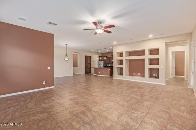 unfurnished living room with recessed lighting, built in shelves, baseboards, and a ceiling fan