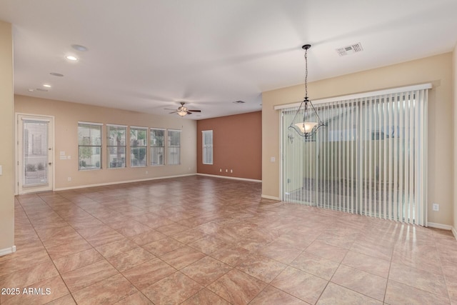 empty room with visible vents, baseboards, light tile patterned flooring, recessed lighting, and ceiling fan with notable chandelier