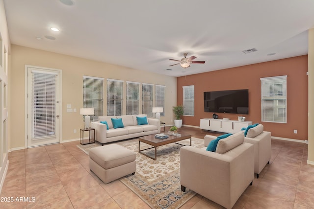 living area with light tile patterned floors, baseboards, visible vents, recessed lighting, and ceiling fan