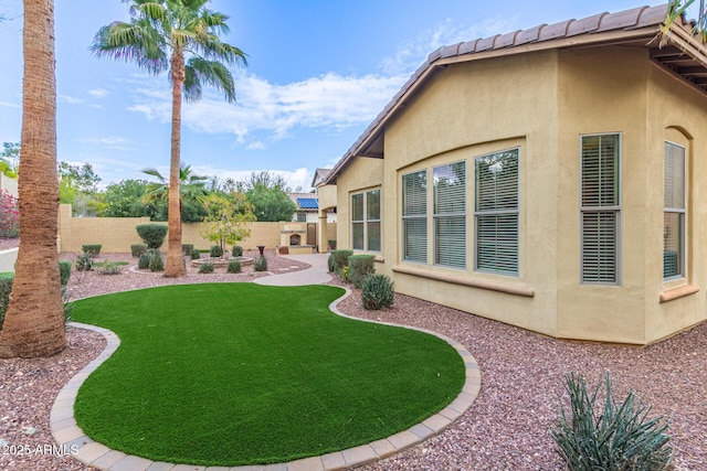 view of yard featuring a patio area and a fenced backyard