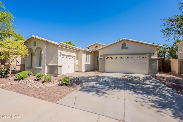 2024 W Darrel Rd, Phoenix, AZ 85041 - view of front of house with a garage, stucco siding, driveway, and a tiled roof