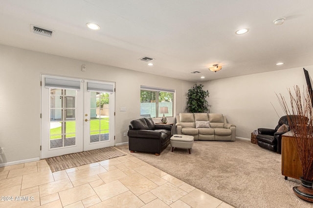 living room with light carpet and french doors