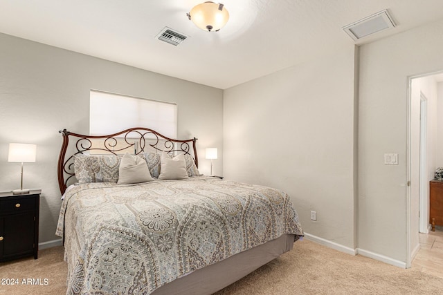 bedroom featuring light colored carpet