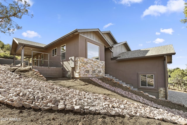 1124 S Sycamore Cir Unit 1, Payson, AZ 85541 - view of side of property with roof with shingles, stucco siding, and stairs