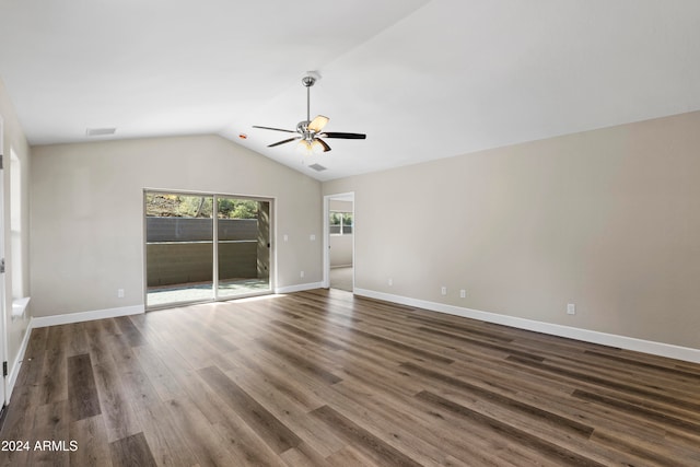 unfurnished room featuring ceiling fan, dark wood-type flooring, and vaulted ceiling