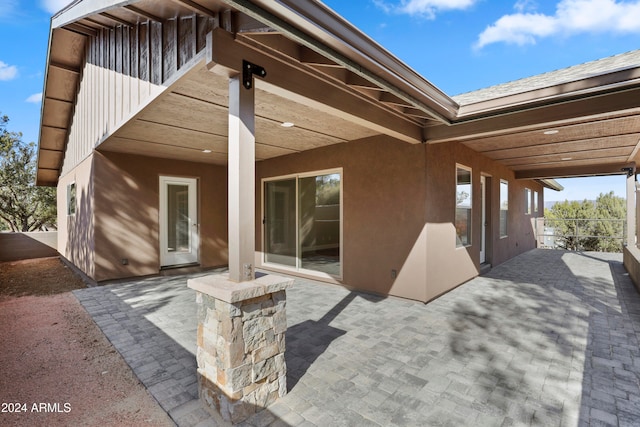 back of house with a patio