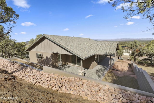 1124 S Sycamore Cir Unit 1, Payson, AZ 85541 - back of property featuring a shingled roof and a mountain view
