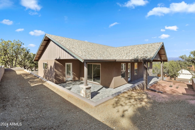 back of house with a patio area