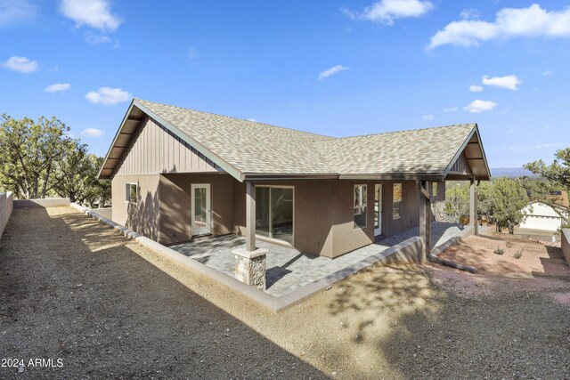 1124 S Sycamore Cir Unit 1, Payson, AZ 85541 - rear view of property featuring roof with shingles and a patio