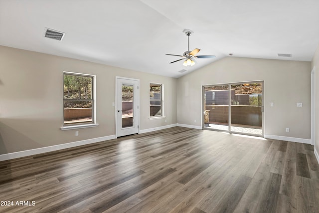 unfurnished living room featuring ceiling fan, dark hardwood / wood-style floors, and lofted ceiling