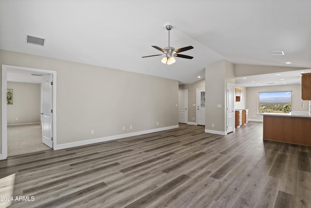 1124 S Sycamore Cir Unit 1, Payson, AZ 85541 - unfurnished living room featuring ceiling fan, vaulted ceiling, wood finished floors, baseboards, and recessed lighting