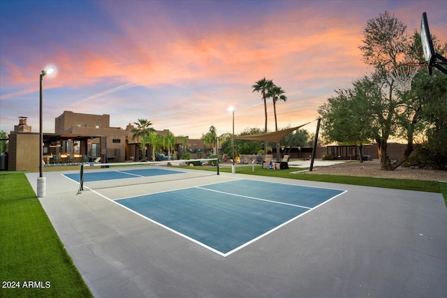 view of sport court with basketball hoop