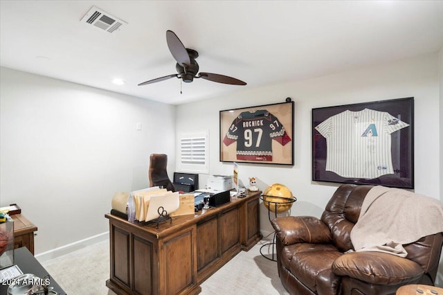 carpeted office featuring ceiling fan