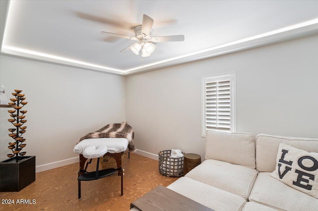 sitting room featuring ceiling fan