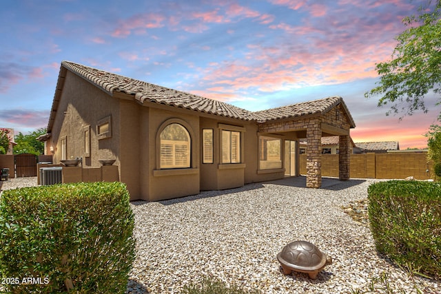 6936 E Snowdon St, Mesa, AZ 85207 - rear view of house featuring stucco siding, a patio area, a tile roof, and a fenced backyard