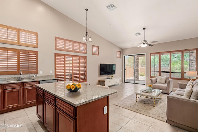 6936 E Snowdon St, Mesa, AZ 85207 - kitchen featuring open floor plan, light tile patterned floors, high vaulted ceiling, ceiling fan, and decorative light fixtures