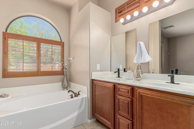 6936 E Snowdon St, Mesa, AZ 85207 - full bathroom featuring double vanity, a garden tub, and tile patterned floors