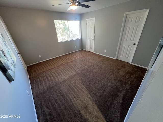 unfurnished bedroom with ceiling fan and carpet flooring